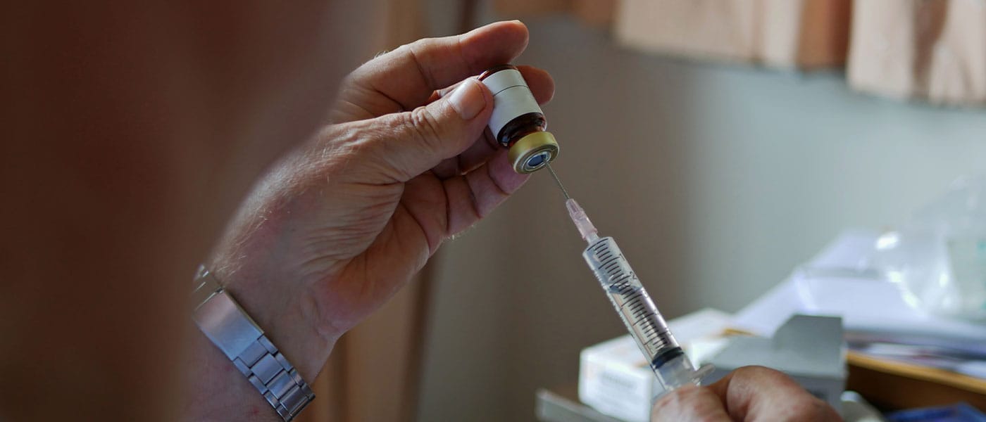 man preparing his testosterone therapy injection