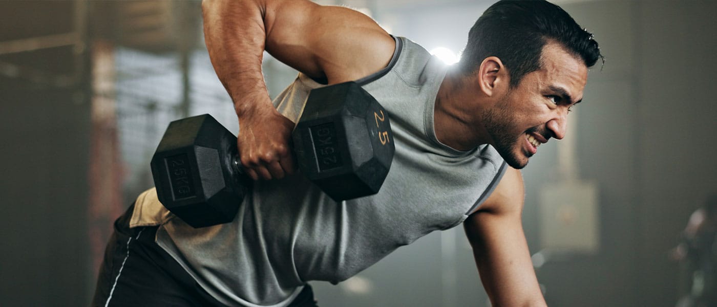 man lifting weights after starting testosterone therapy