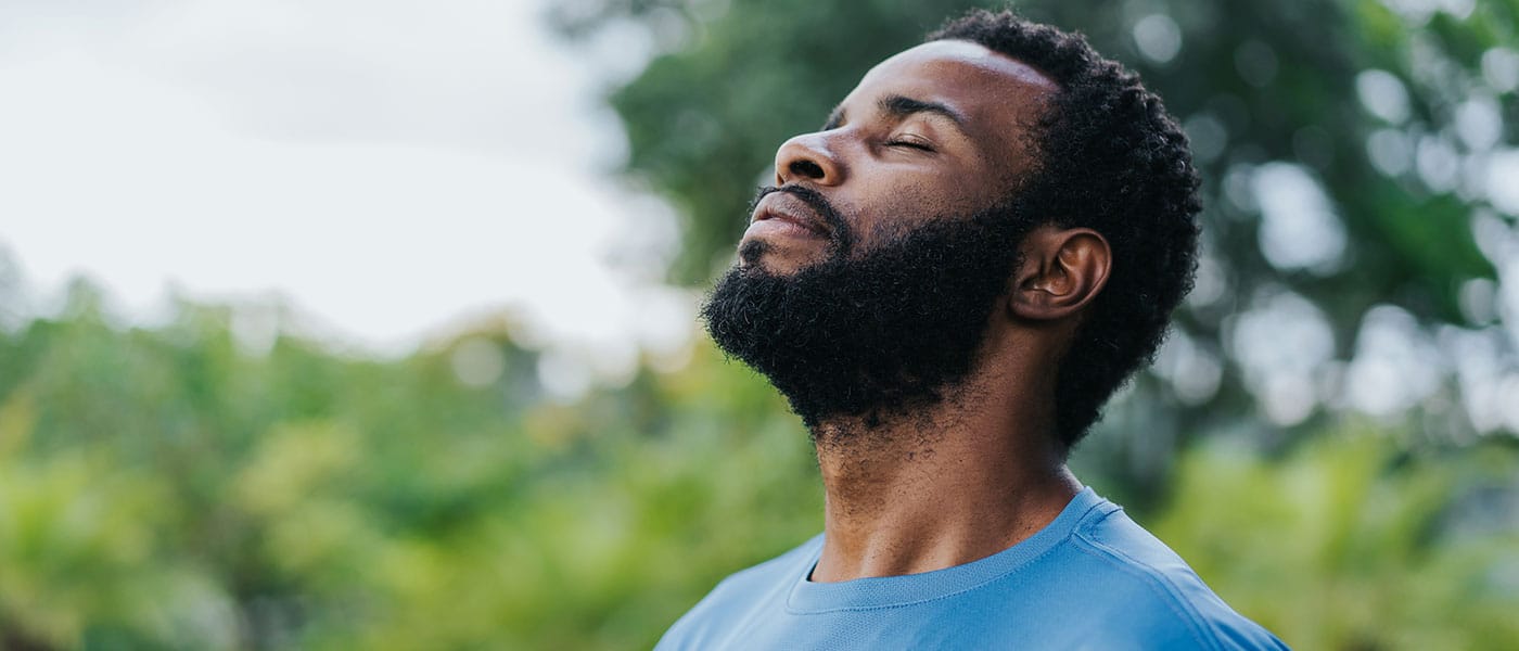 man feeling peaceful after starting testosterone therapy
