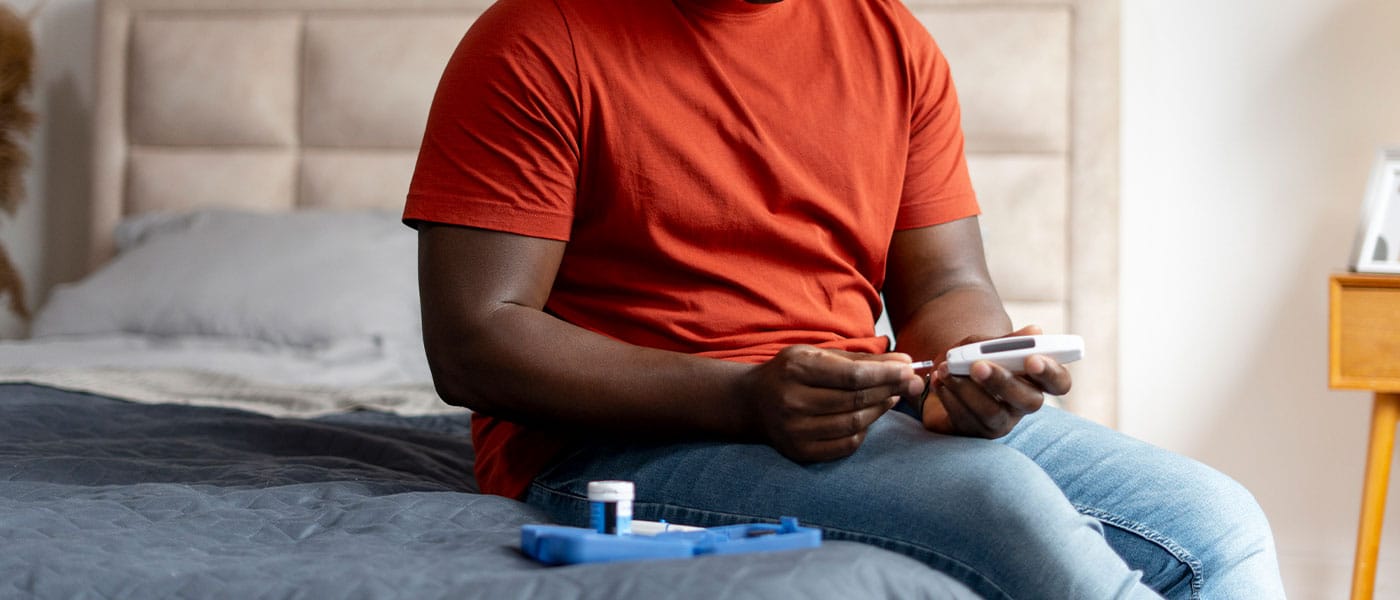 diabetic man on testosterone therapy testing his blood sugar