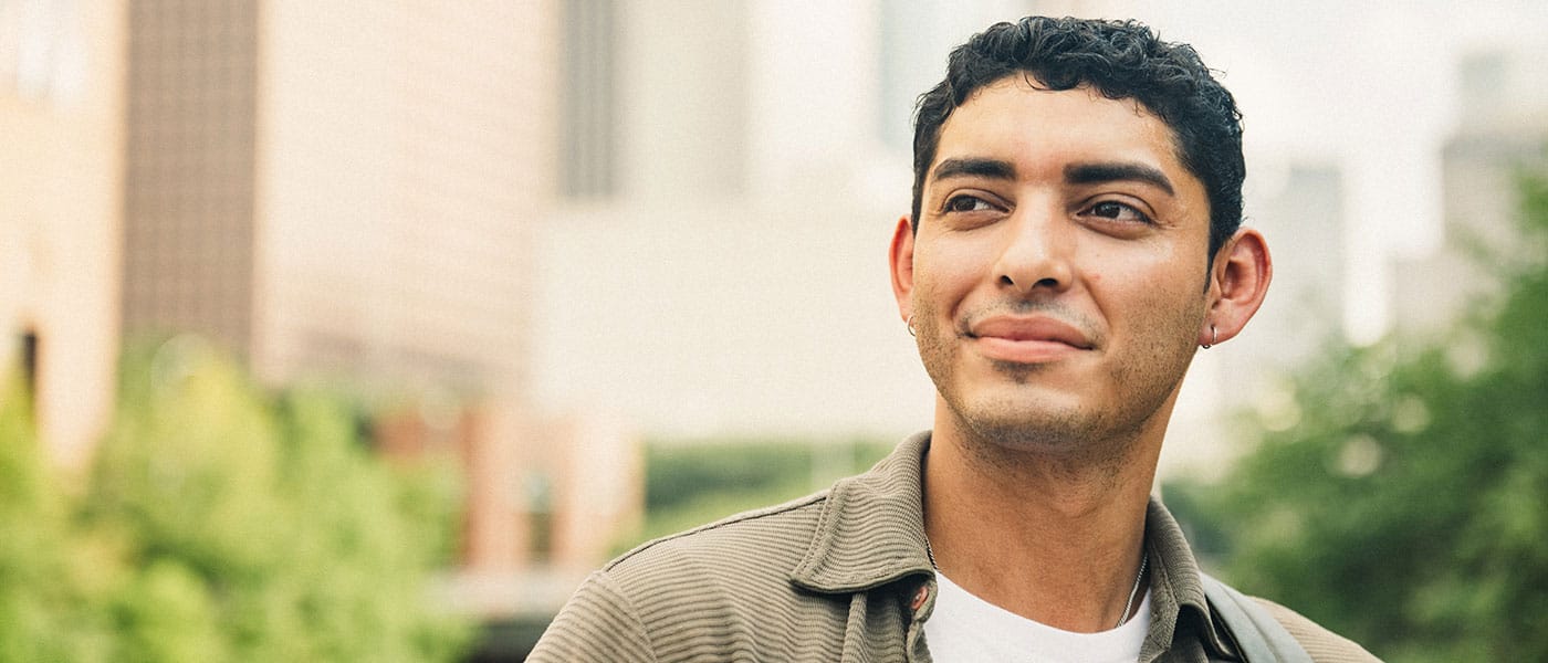 man smiling after starting testosterone therapy