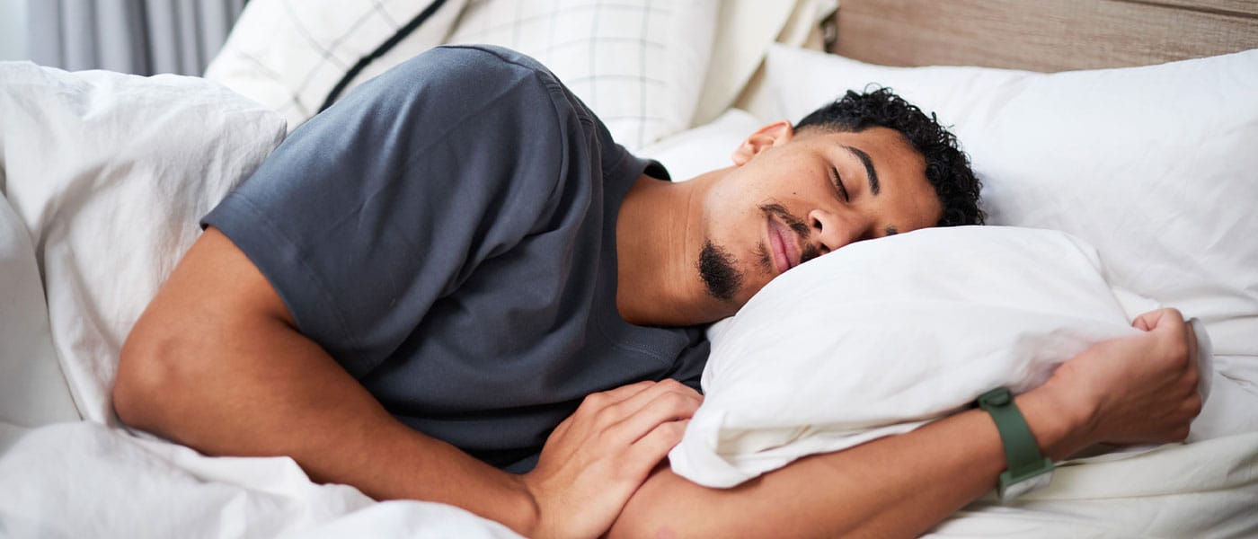 man sleeping restfully after starting testosterone therapy