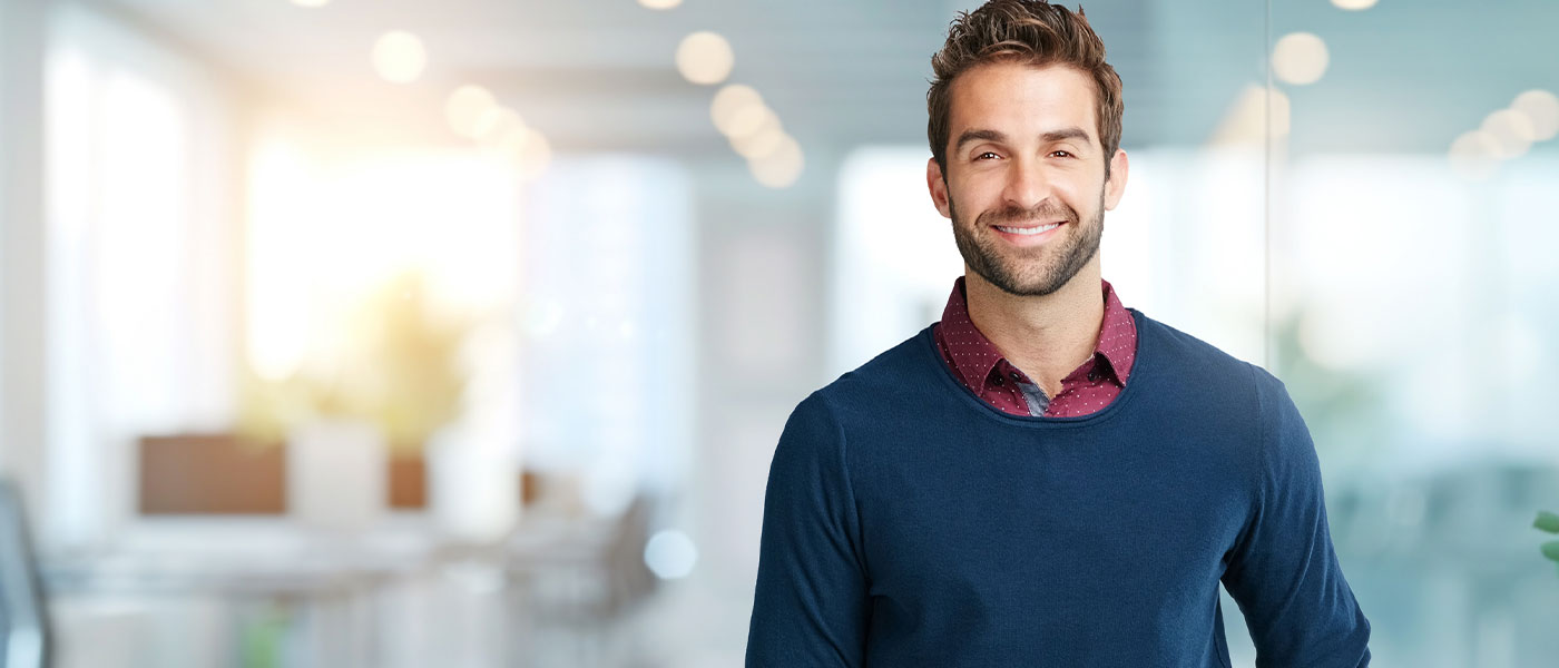 man smiling after starting hormone therapy