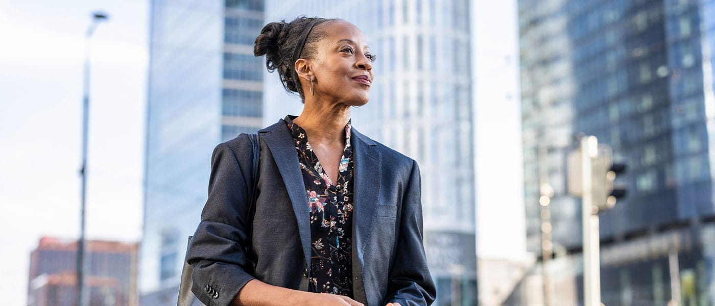 older woman feeling happy after starting hormone therapy