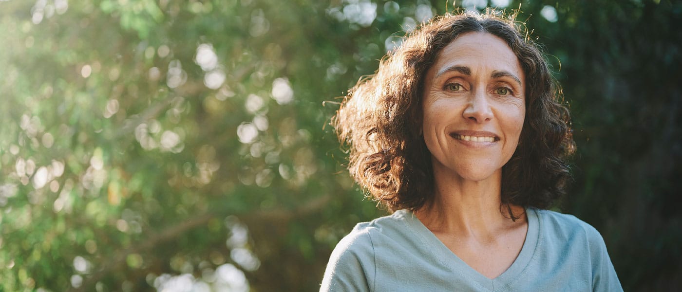 older woman smiling after starting NAD therapy