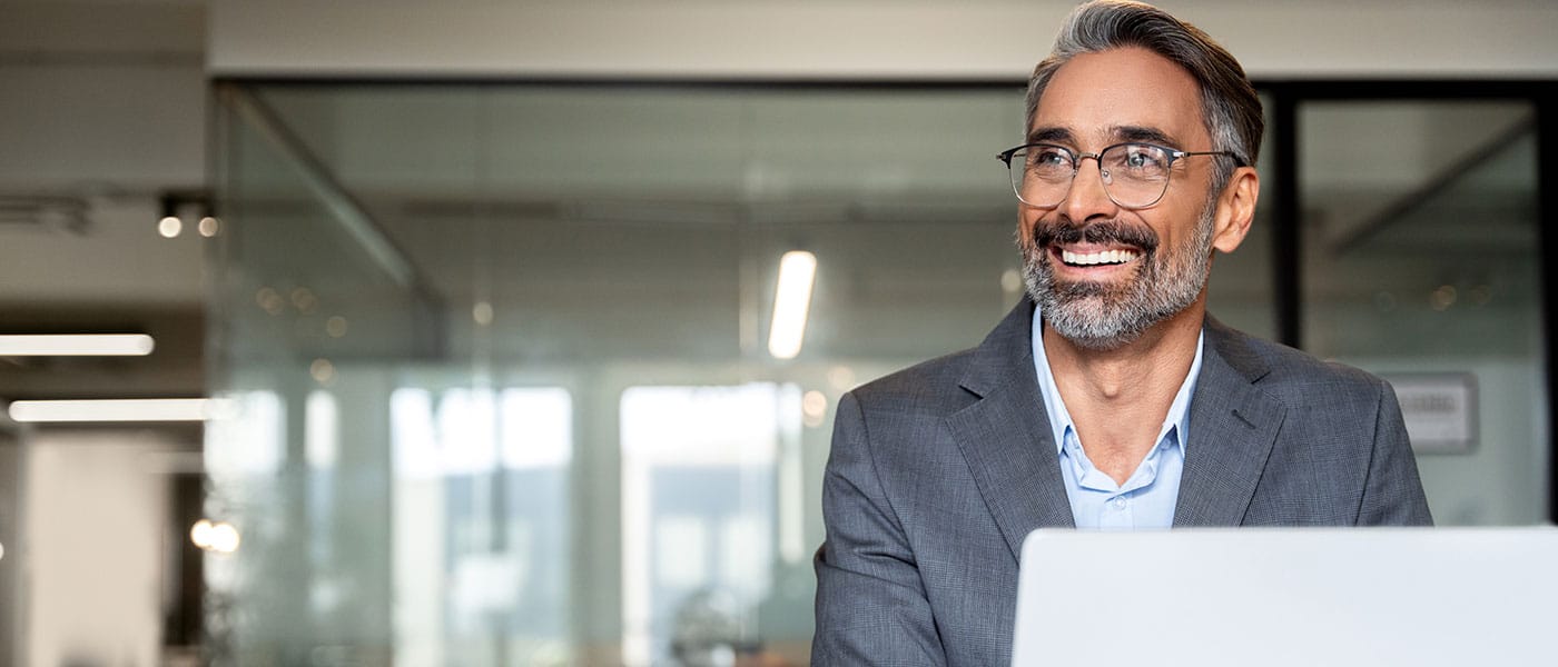 man happy at work after starting sermorelin therapy
