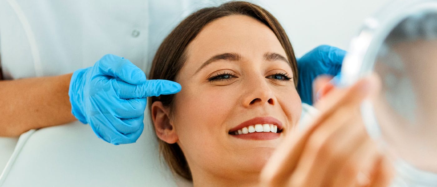 woman smiling after getting botox