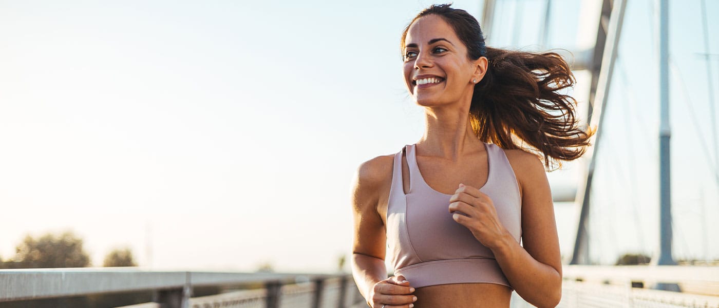 woman running outside after getting IV therapy