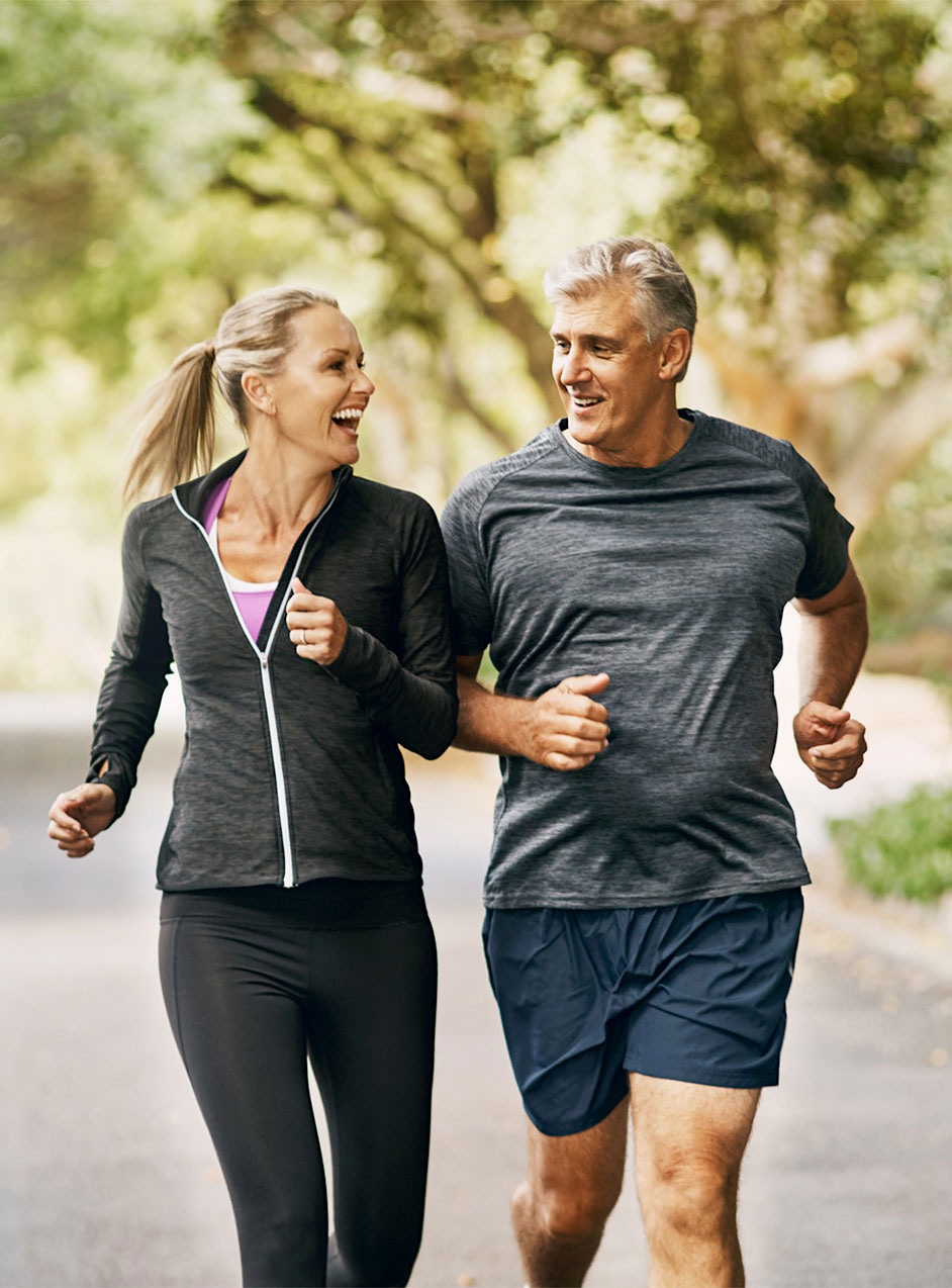 older couple jogging with energy after HRT treatment in Indianapolis, IN
