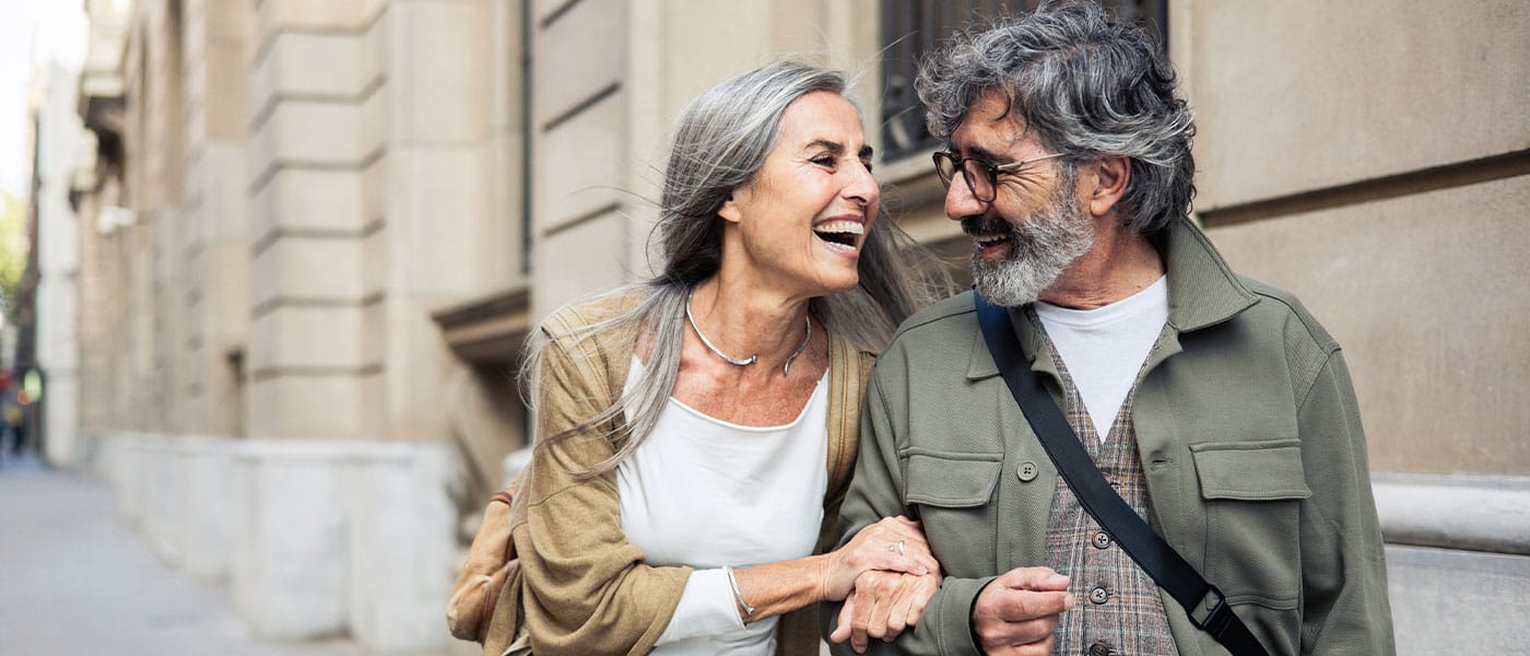 older happy couple after leaving their first hormone therapy appointment