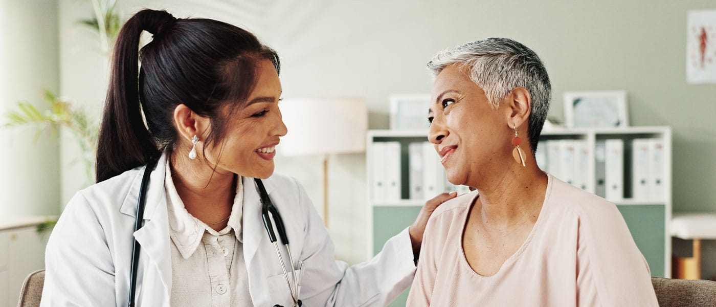 woman and her doctor at her first hormone therapy appointment