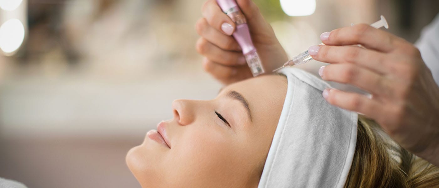 woman getting microneedling treatment