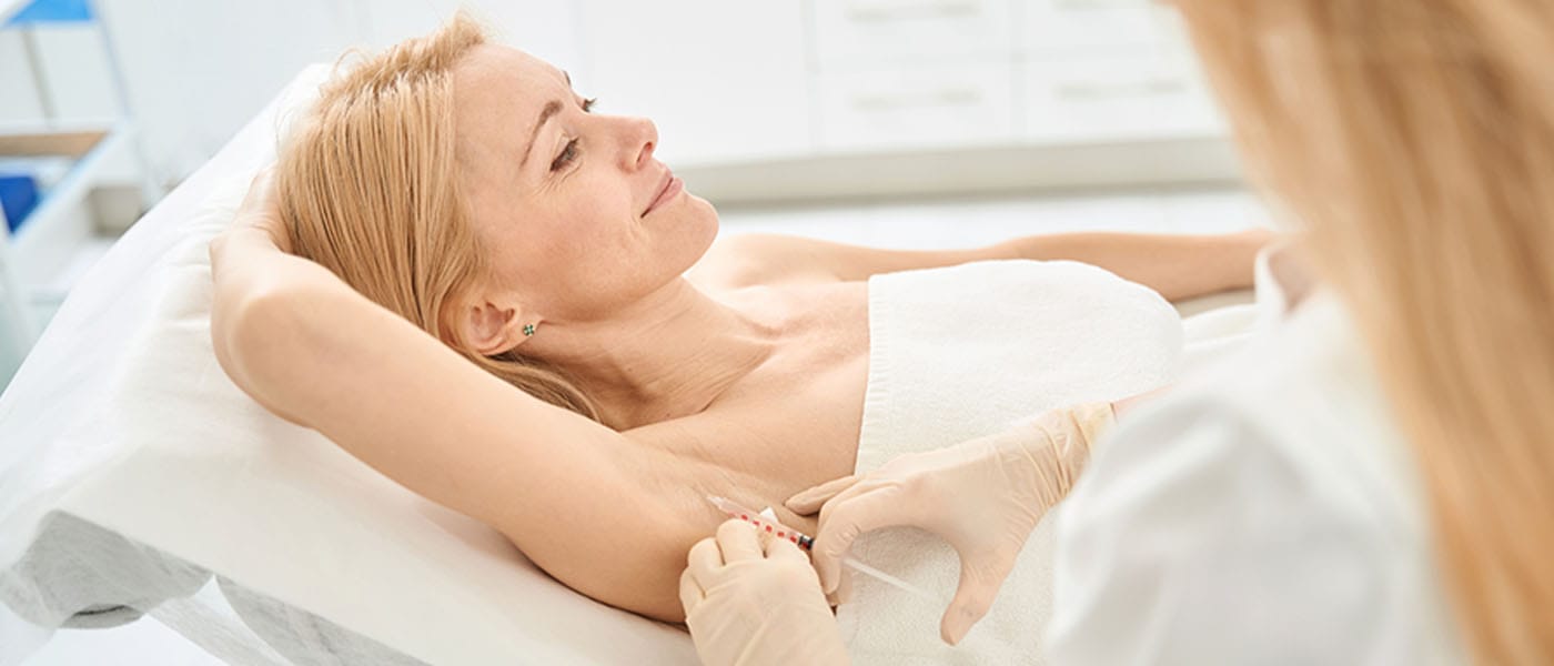 woman getting botox for underarm sweating