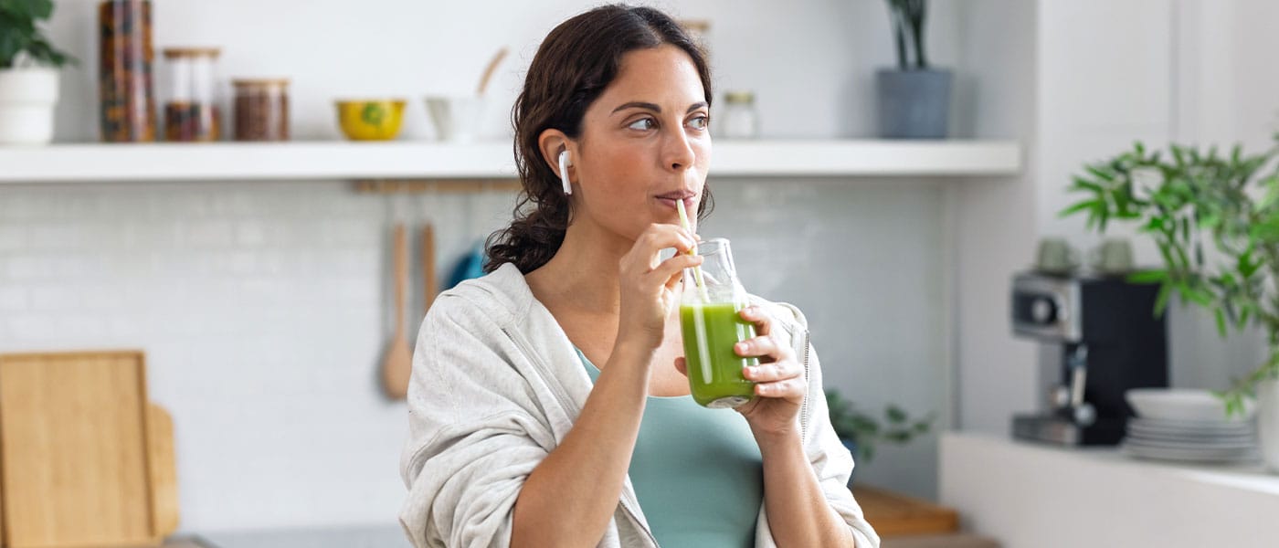 woman drinking a beverage
