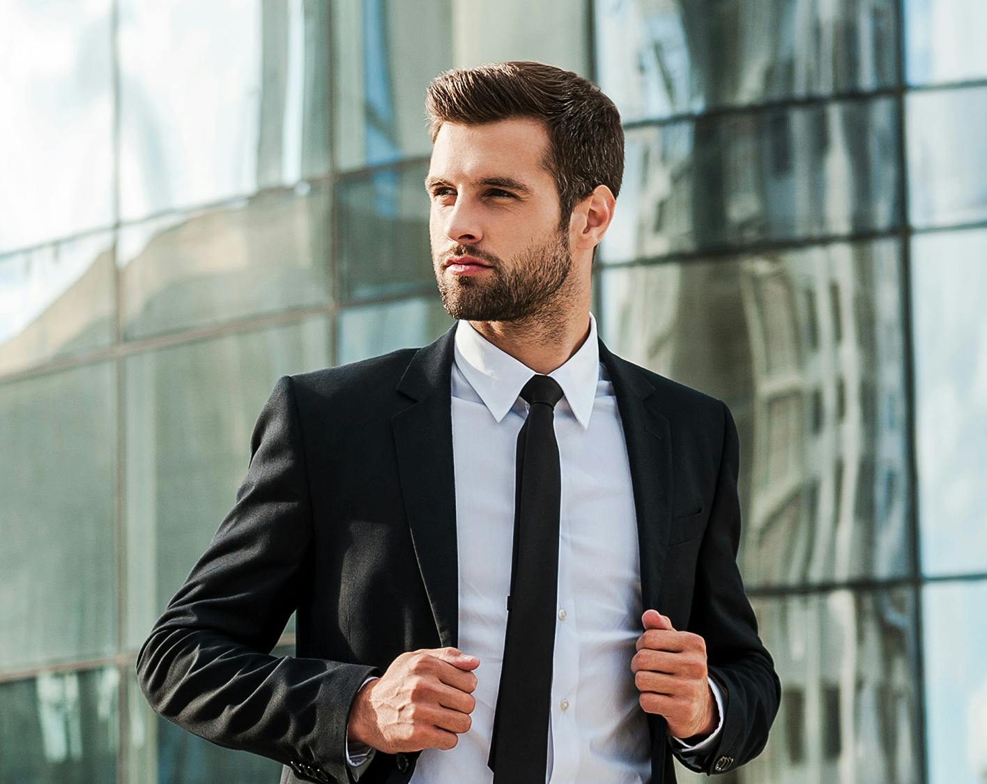 Man in Business suit walking with confidence to work after PRP Hair Restoration in Pittsburgh