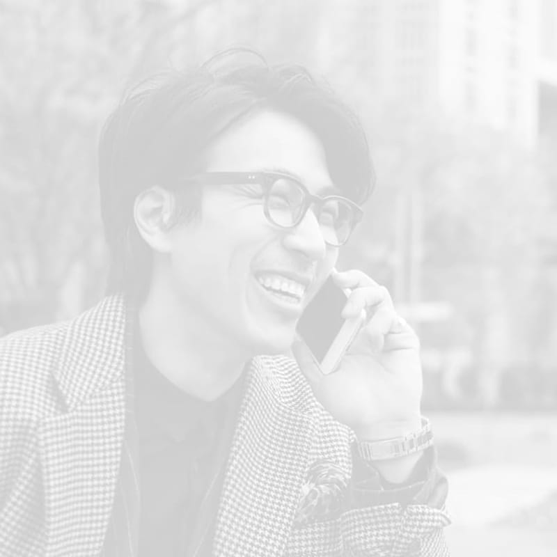 Man Smiling on the Phone