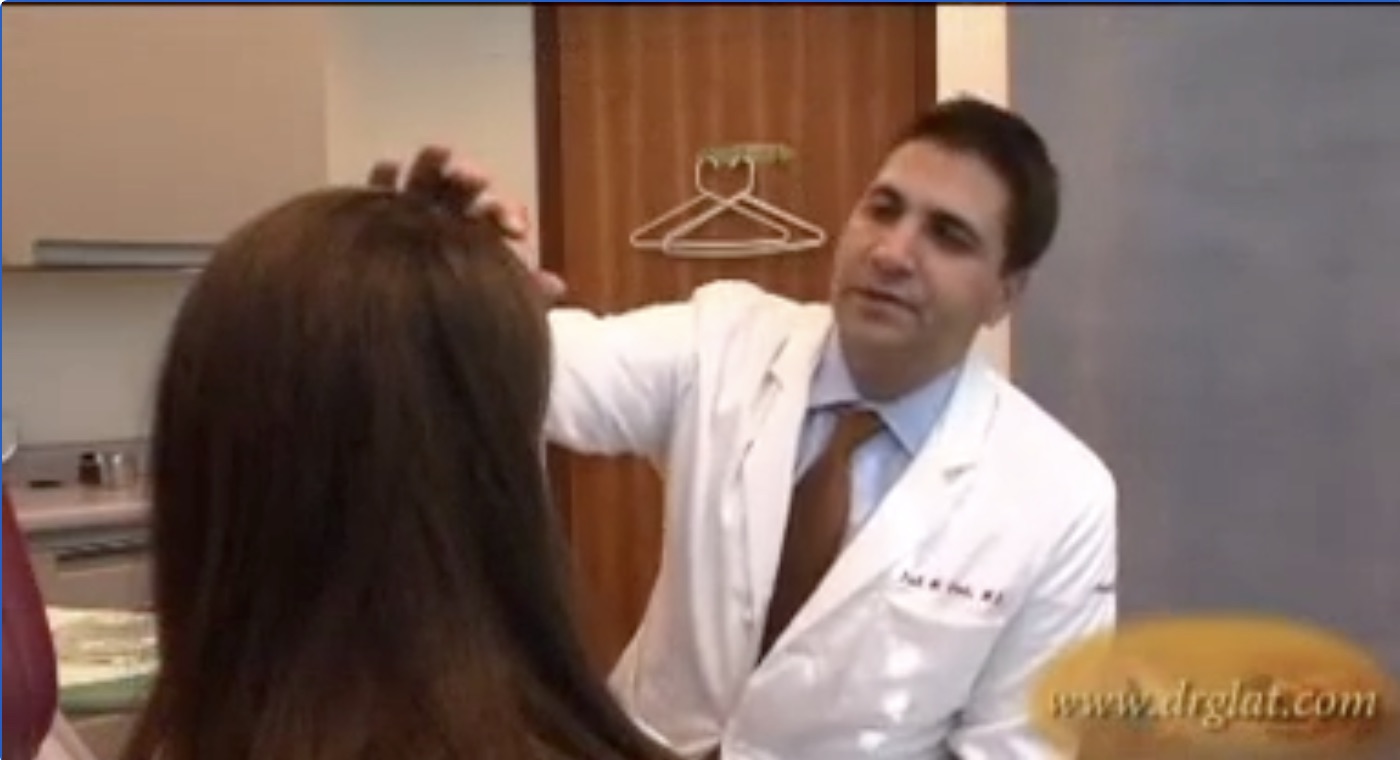 Dr. Glat looking at a Patient's Face