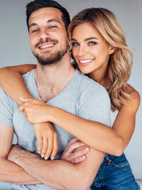 Woman hugging man