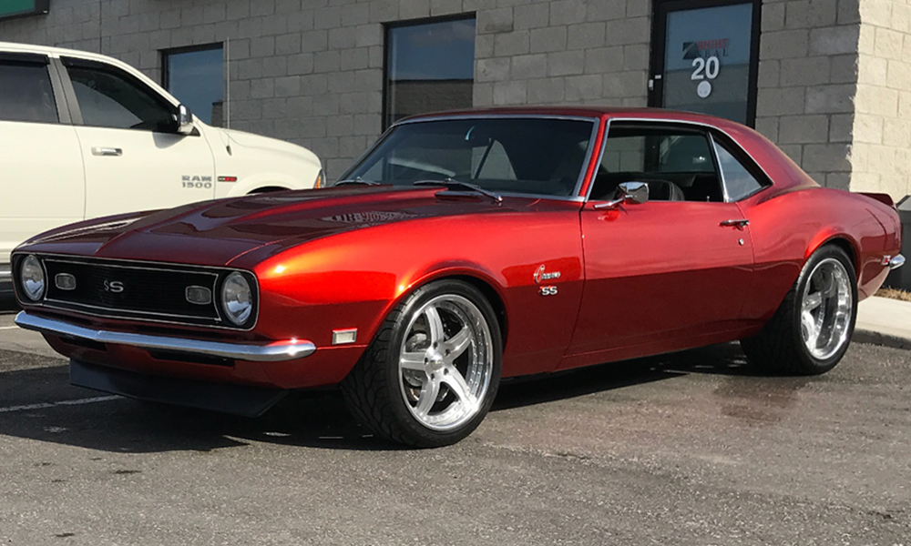 1968 Camaro featuring Universal Pro Series Low Back seats with SPORT-R design including black vinyl, suede, and white contrast stitching. Paired with matching door panels.