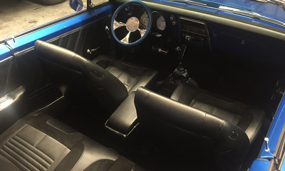 1968 Camaro featuring original style seating with a SPORT-R design including black vinyl and suede accents. Includes matching door panels and center console.