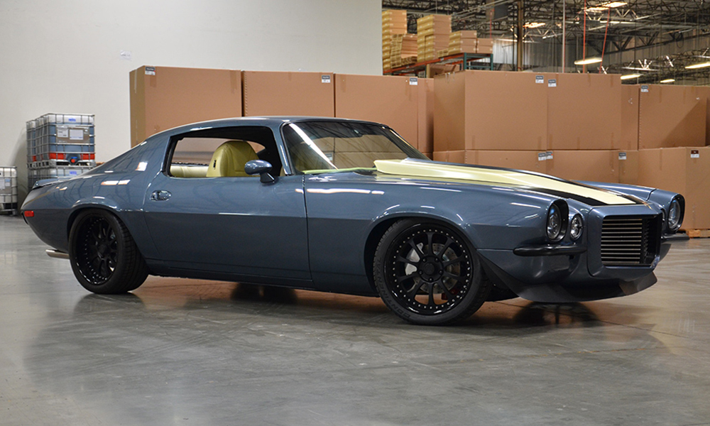 1970 Camaro featuring Universal Pro Series High Back seats with SPORT-XR design with yellow and black perforated vinyl, black  suede, black contrast stitching, and black grommets. Includes matching rear seat, center console, door panels, and dash pad.