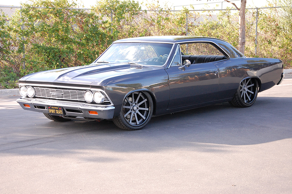 1966 Chevelle featuring standard SPORT-R seats with white vinyl and gray suede. Includes matching rear seat, center console, and door panels.