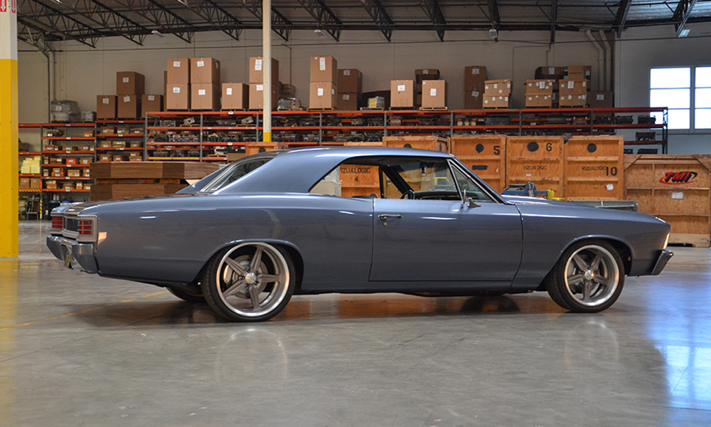 1967 Chevelle featuring standard SPORT-XR seats with off-white and dark gray perforated vinyl, off-white suede, and silver grommets. Includes matching rear seat, center console, door panels, and a headliner.