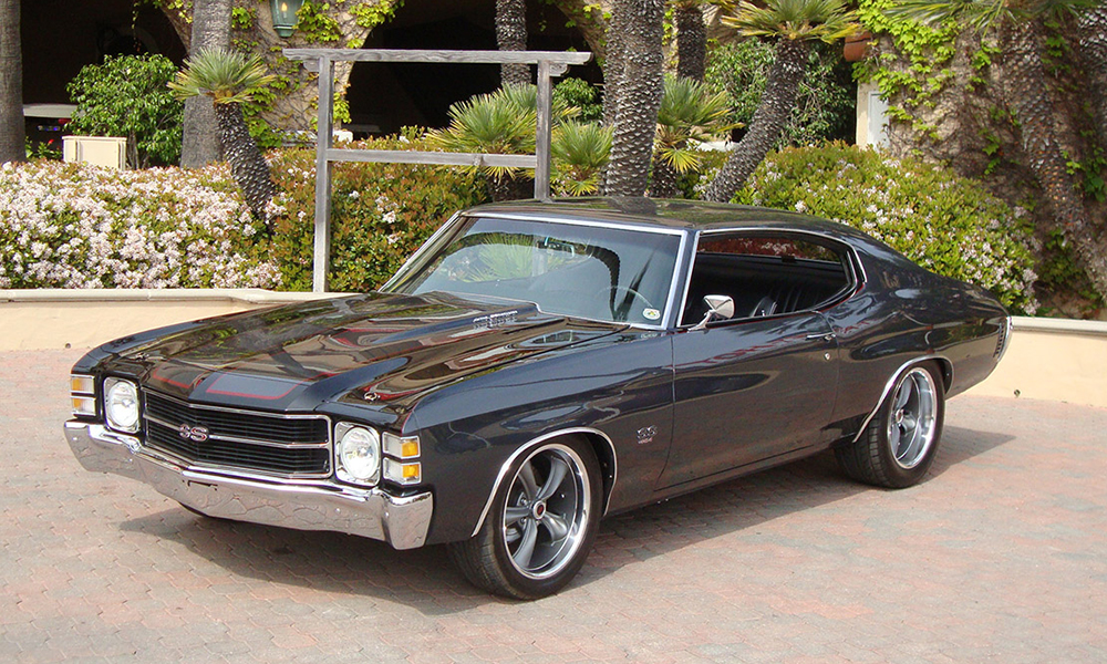 1971 Chevelle SS featuring replacement standard SPORT -R seats with black vinyl, black suede, black perforated vinyl accents, and white contrast stitching. Includes matching rear seat.