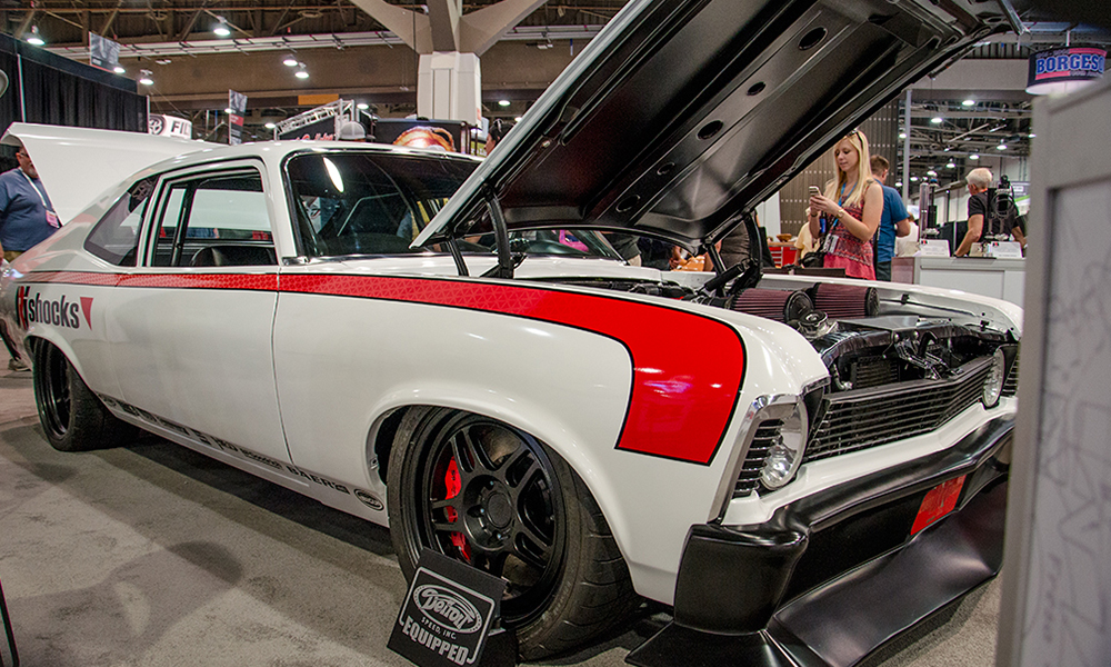 1967 Chevelle featuring Universal Pro Series Low Back seats in black with red contrast stitching. Includes matching rear seat with replacement door panels and center console.