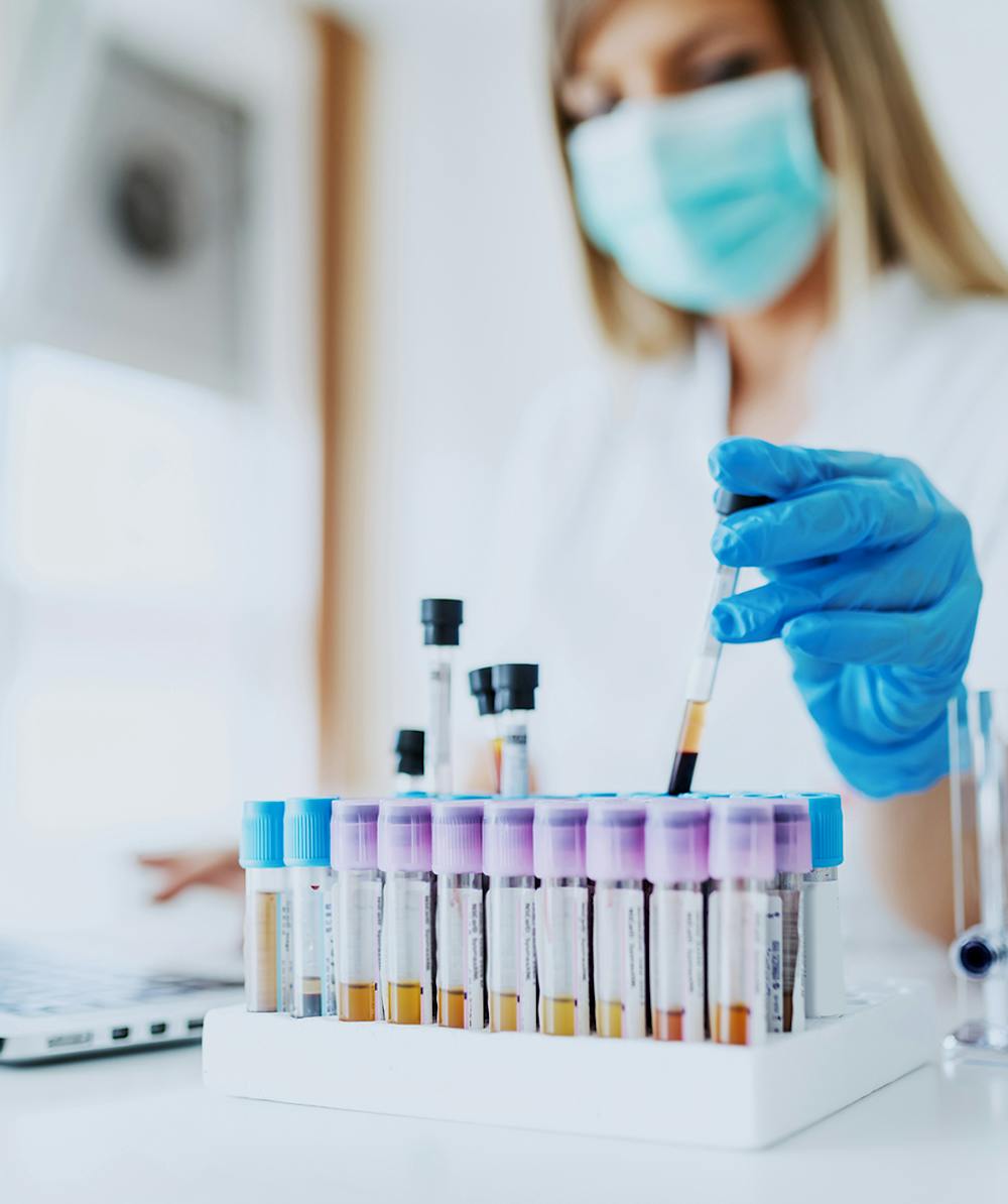 Doctor dealing with vials