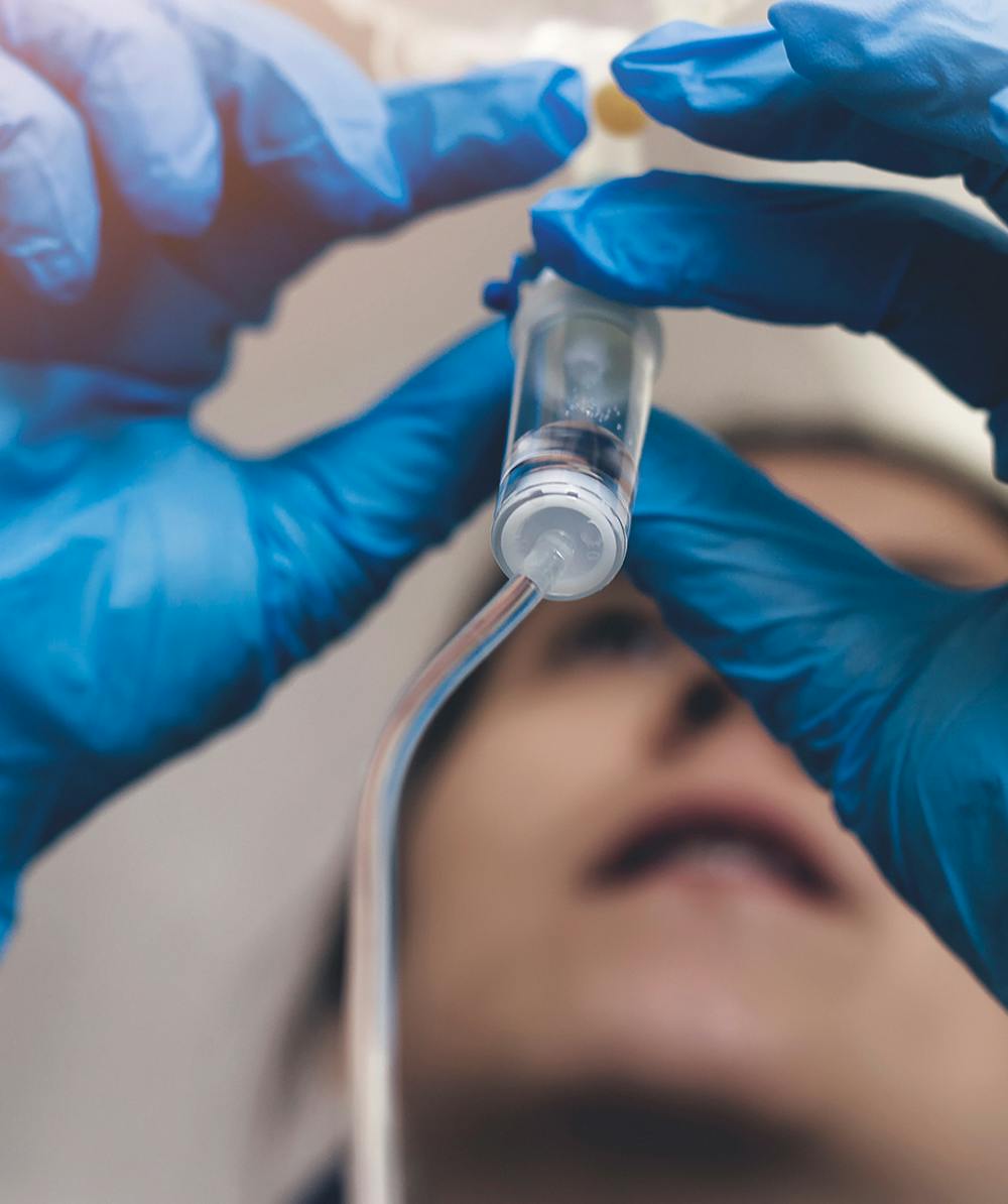 Doctor taking a closer look at patient's tubes