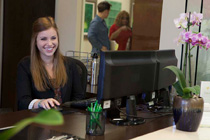 Front desk staff smiling