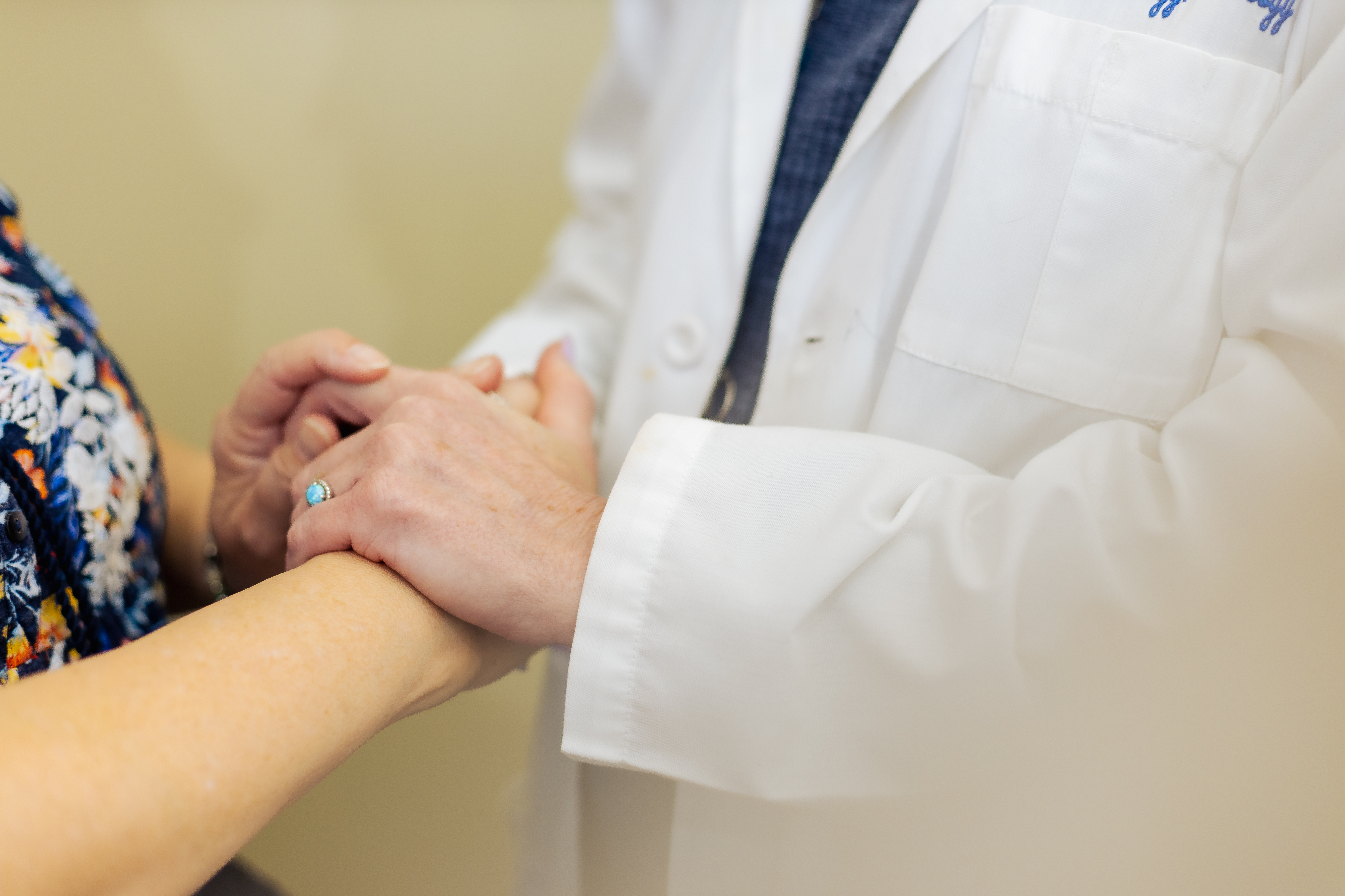 doctor consoling a patient