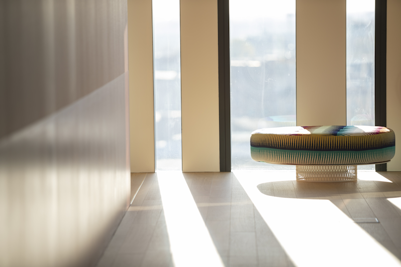 Detail of the light reflecting through the large glass windows of the studio