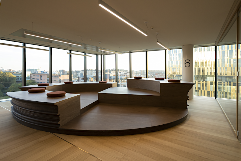 Sixth floor meeting area with large circular benches