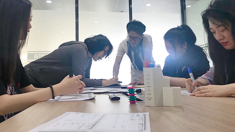 Designers work on wireframes in the Shanghai studio