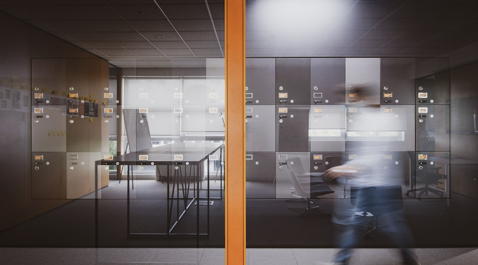 Detail of the interior of the studio reflected on the glass