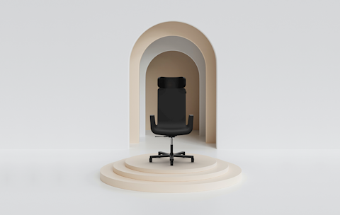 black silente chair on beige podium and arched background
