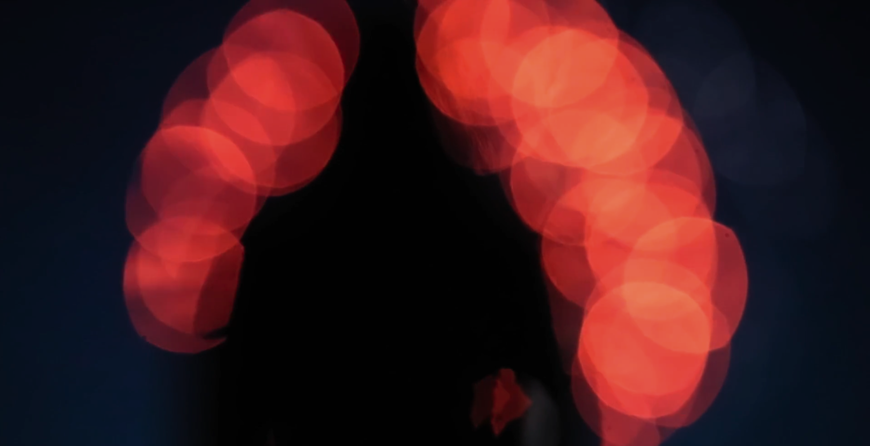 Red lights on black background