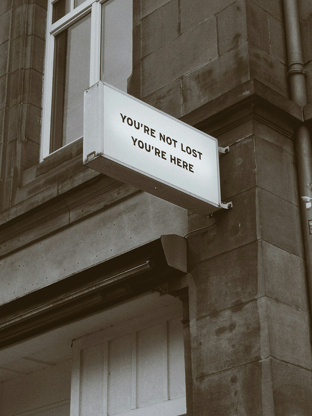 Sign that reads you're not lost, you're here