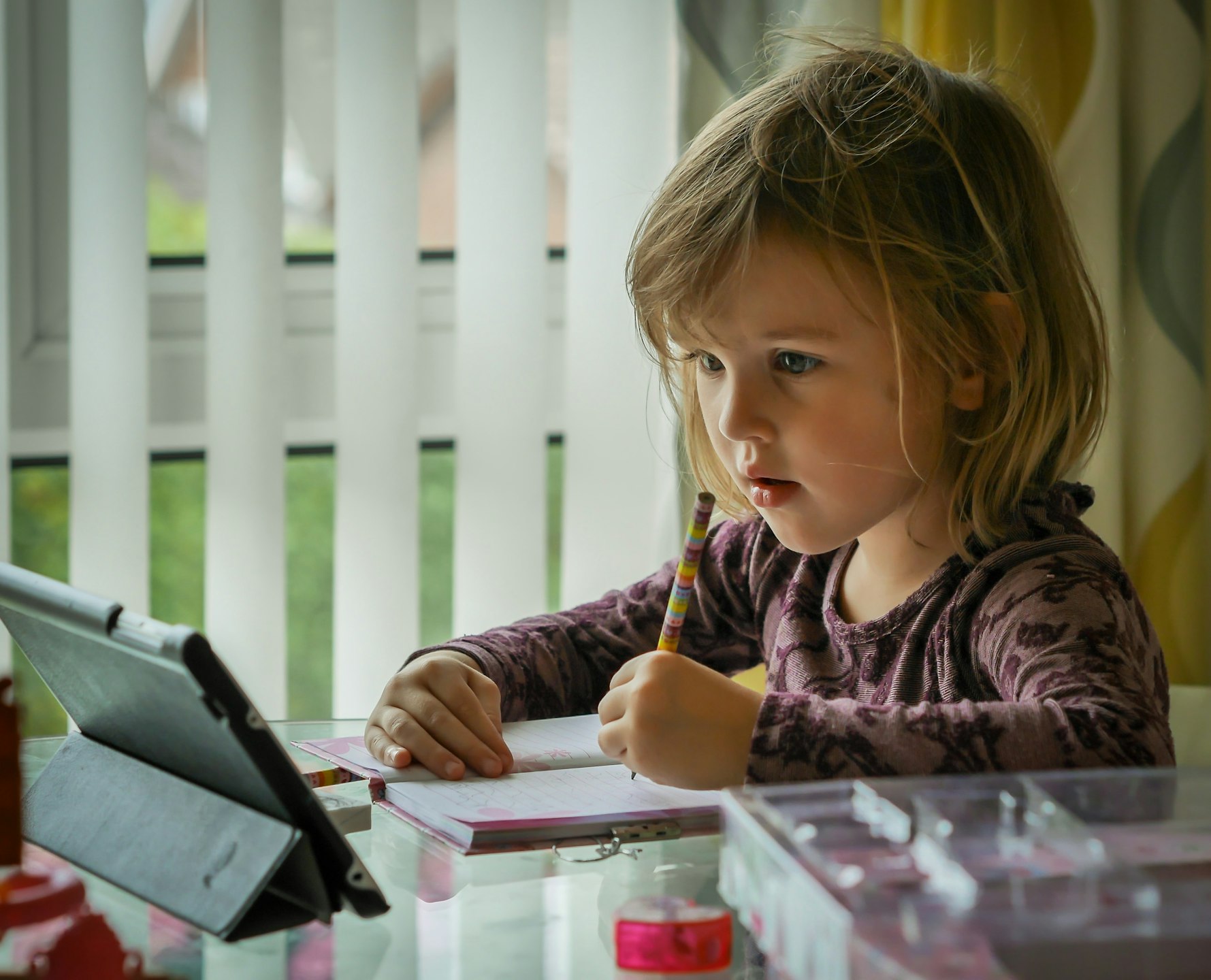 Girl learning from home (image by Carl Jorgensen on Unsplash)