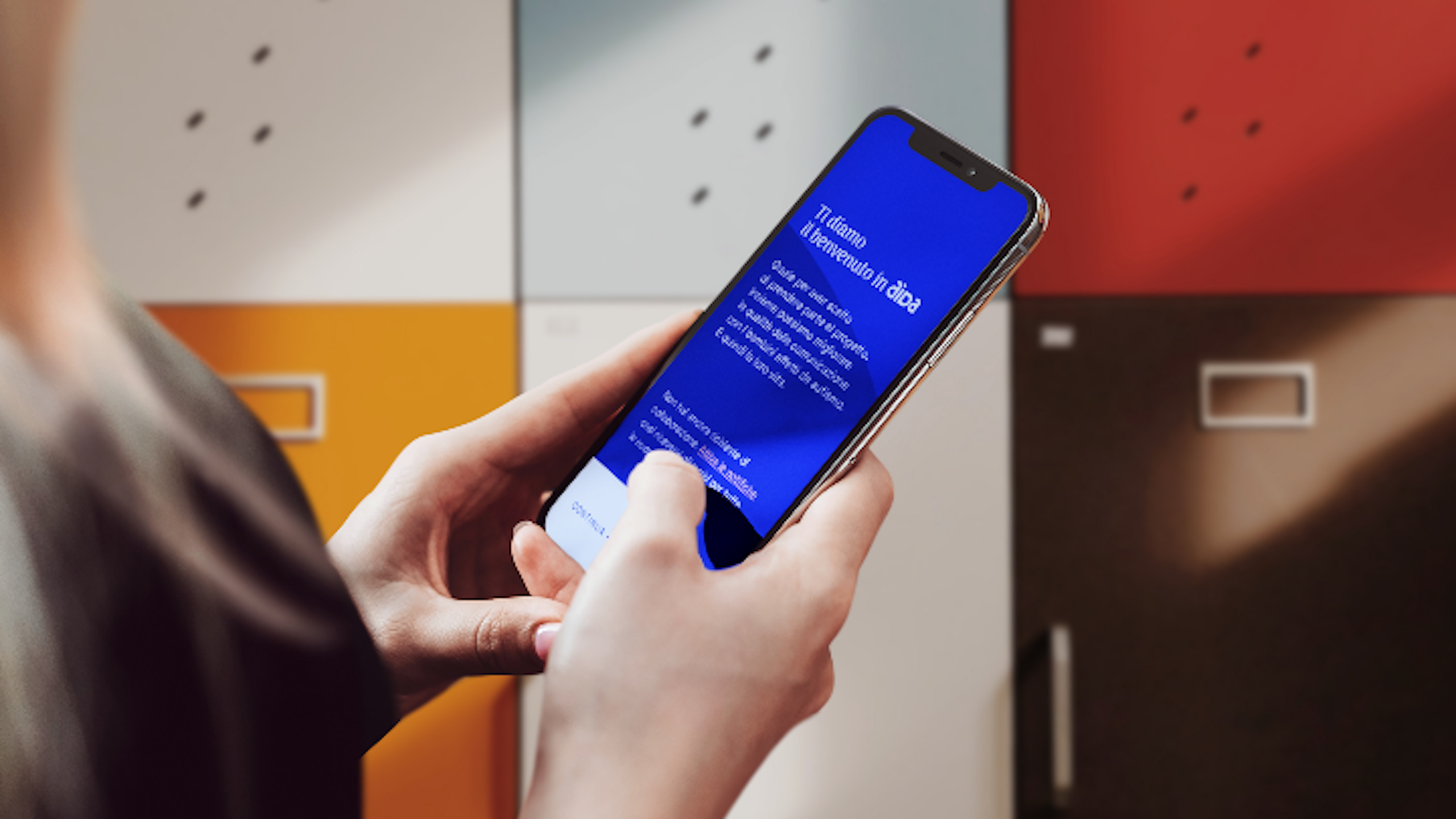 Woman holding phone in hand with aida app opened