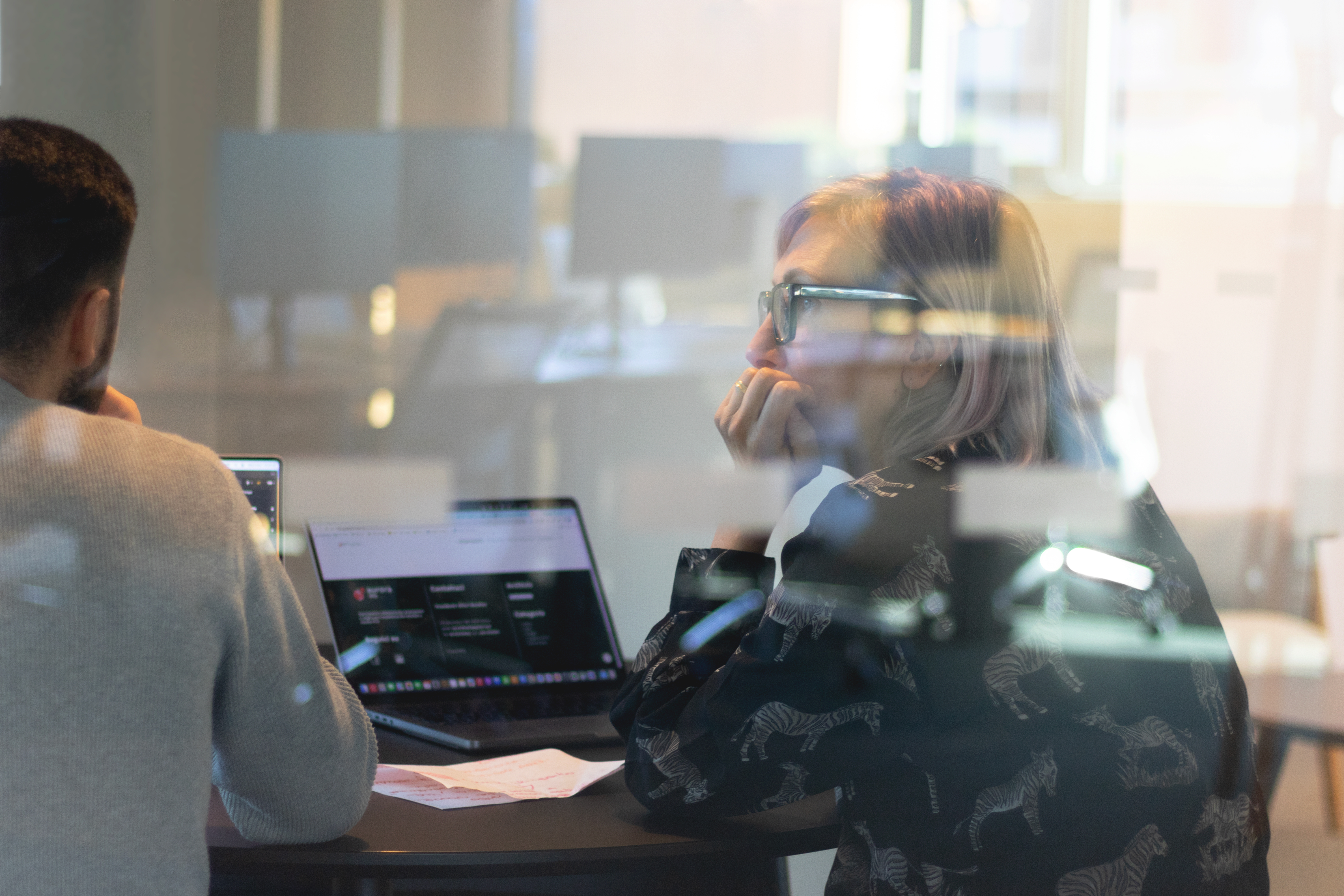 Two designers work together in one of the corners of the studio