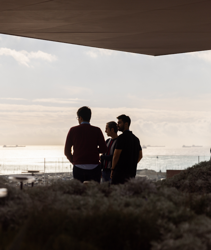 Three designers enjoying the sunset from Tangity Barcelona's rooftop