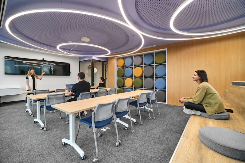 Three people discussing in AEI space