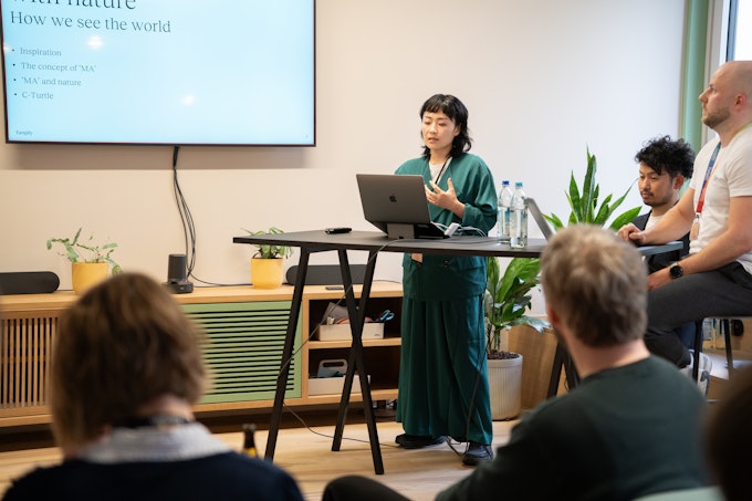 Ayaka Yamada presenting to the audience.