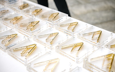 Compasso d'oro awards lying flat on table