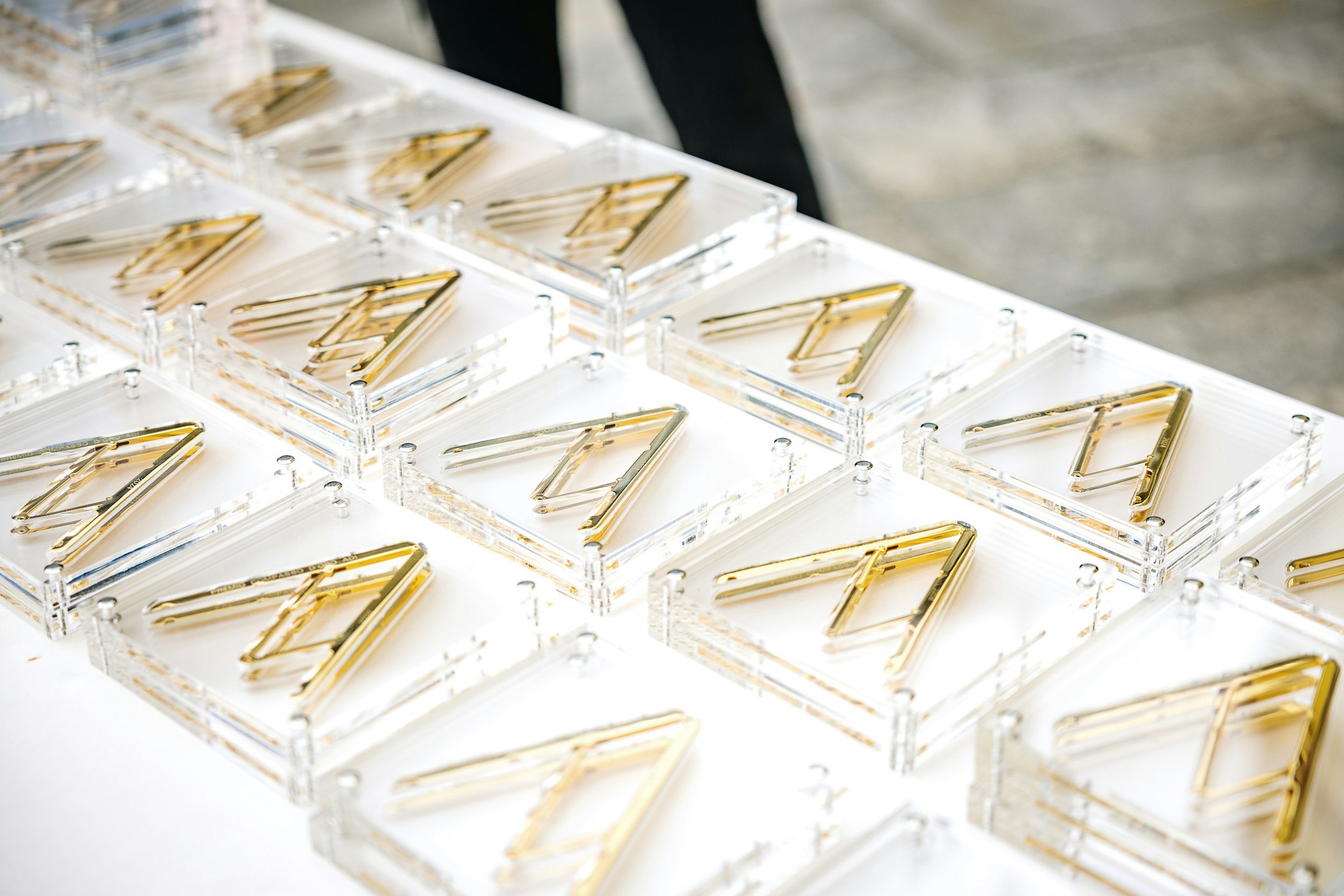 Compasso d'oro awards lying flat on table