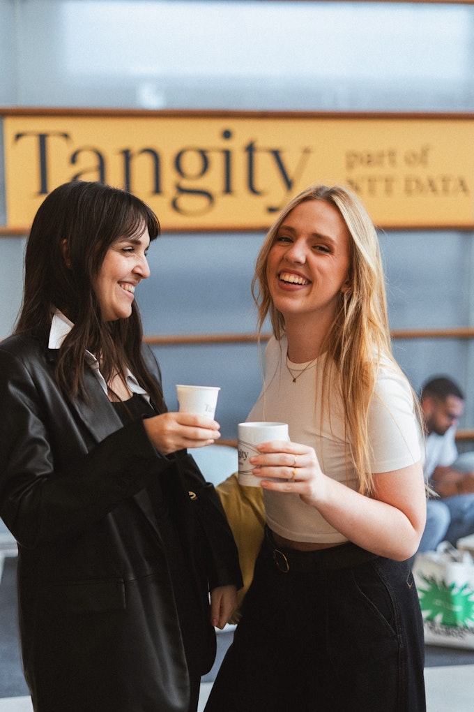 Two visitors enjoying their coffee at the at the Tangity Offline Club.
