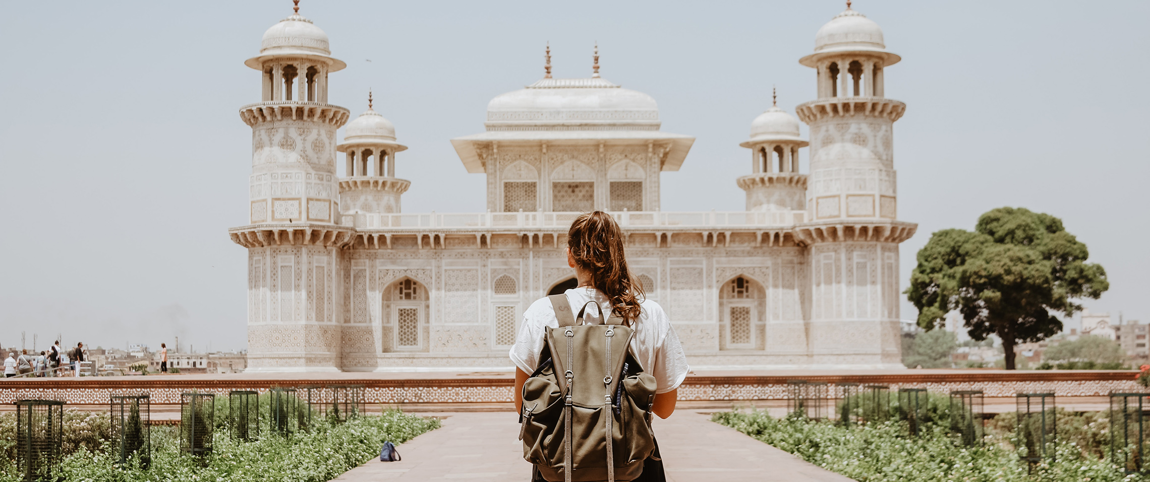 Woman viewing white temple